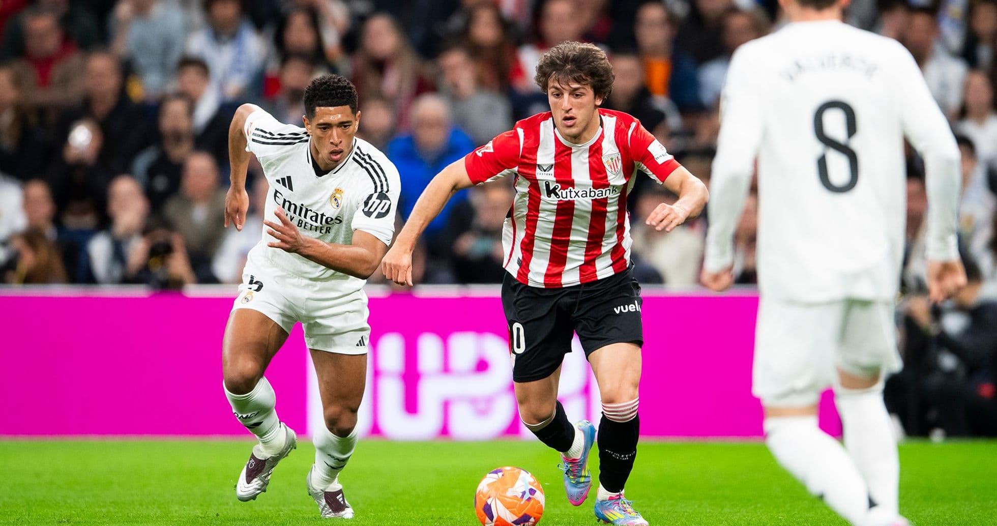 Real Madrid player chasing Athletic Club player