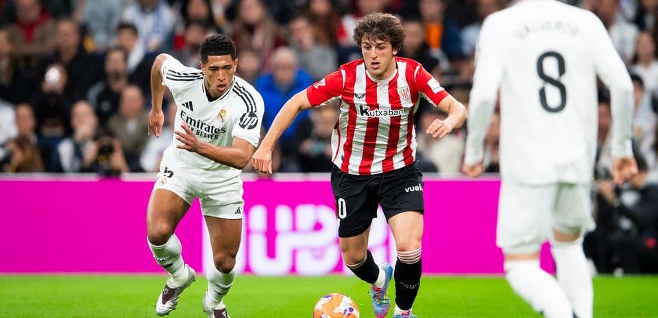 Real Madrid player chasing Athletic Club player