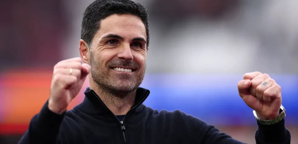 Manager celebrating with raised fists and smile