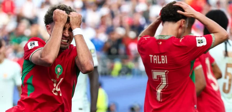 Moroccan players react after missed opportunity during match