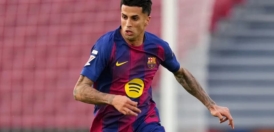 Player in FC Barcelona kit running on the field