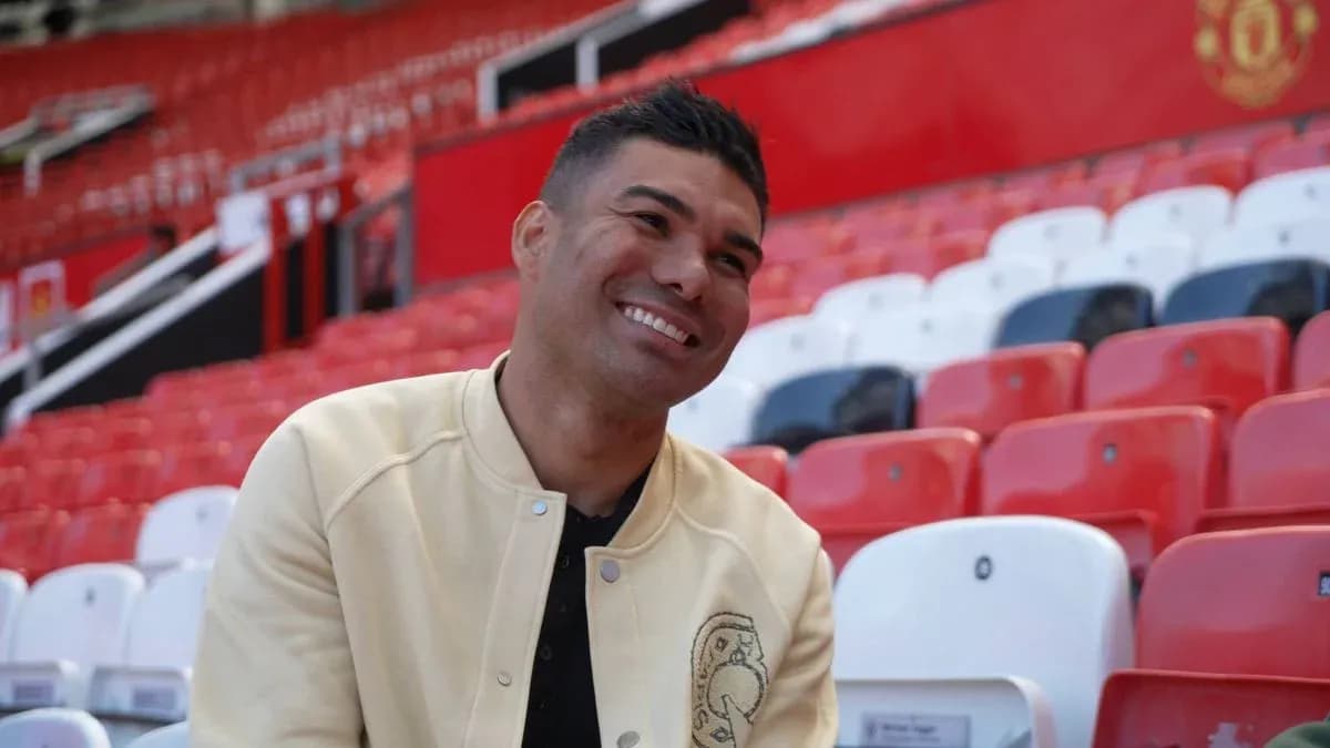 Player sitting in empty stadium seats at Old Trafford