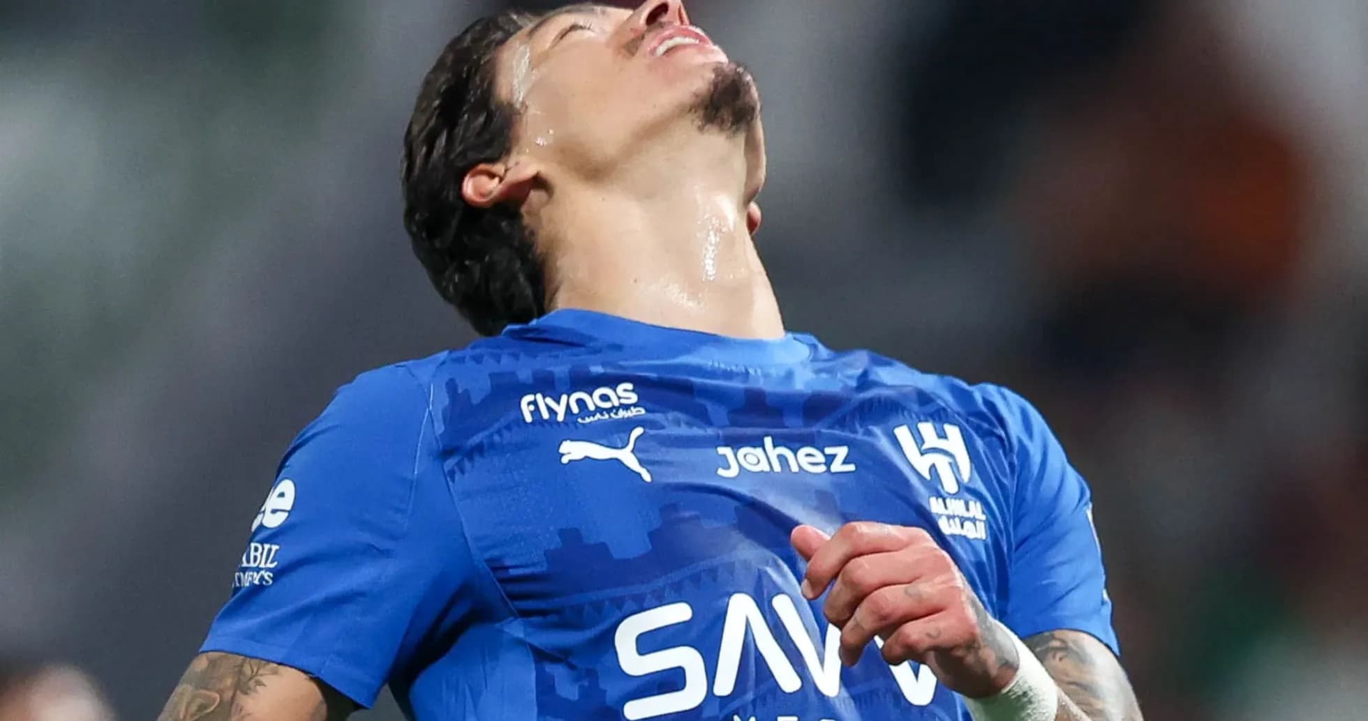 Player reacting during a match in blue jersey