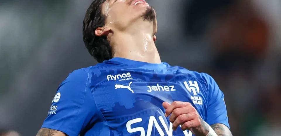 Player reacting during a match in blue jersey