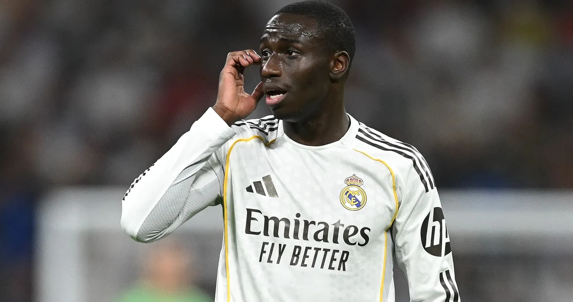 Player communicating during match in Real Madrid jersey