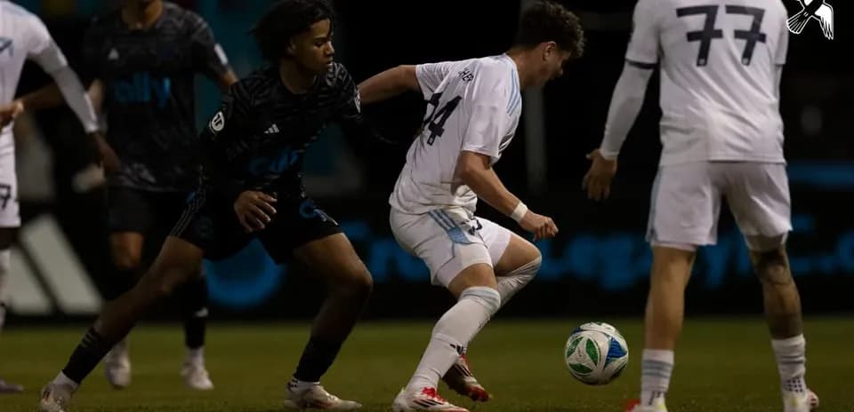 Players competing for the ball during match
