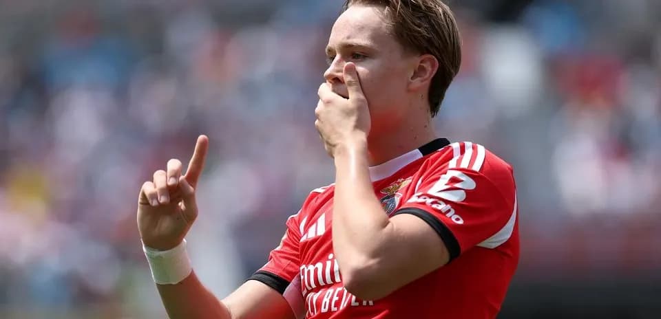 Player celebrating goal with finger raised in air
