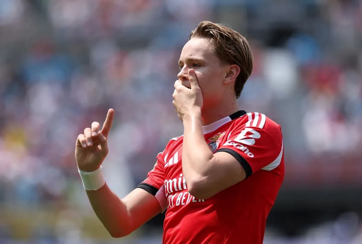 Player celebrating goal with finger raised in air