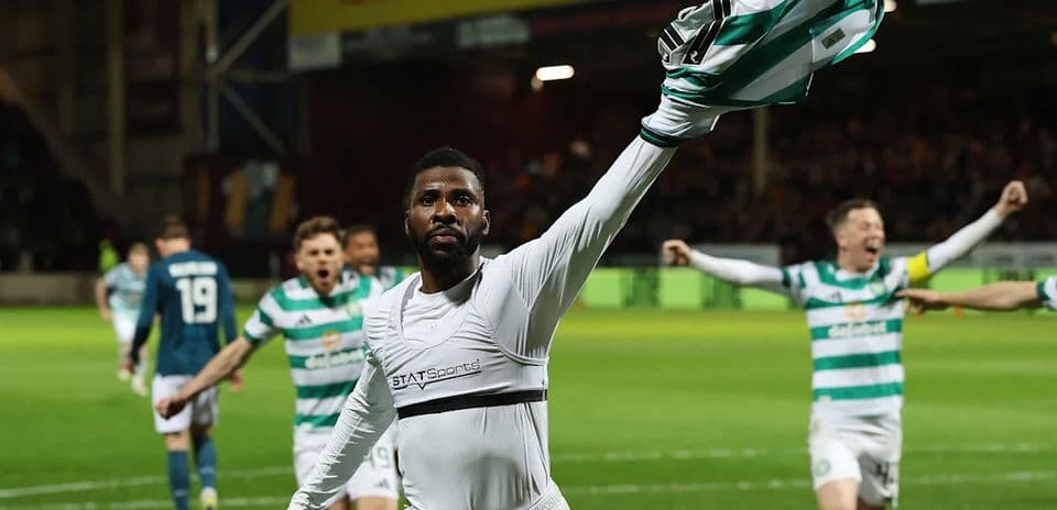 Celtic player celebrating with teammates after scoring