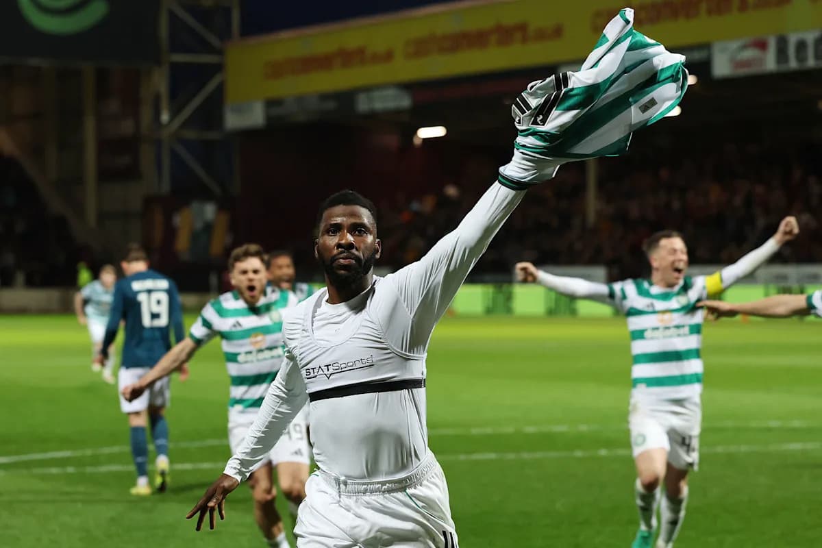 Celtic player celebrating with teammates after scoring