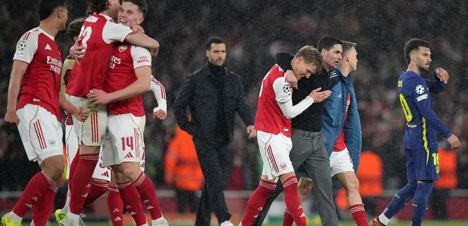 Arsenal players celebrating victory in Champions League