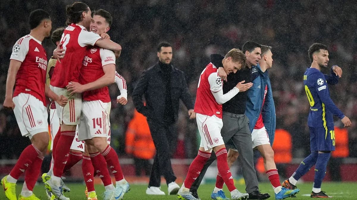 Arsenal players celebrating victory in Champions League
