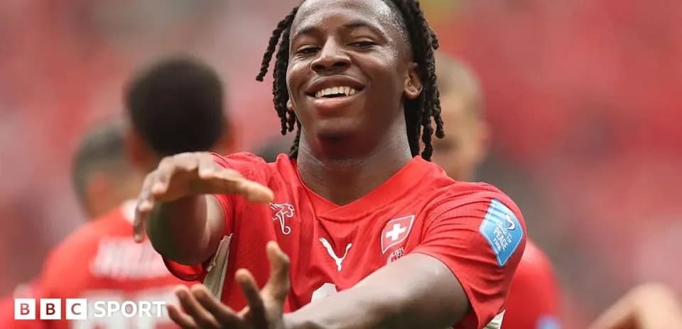 Player celebrating in red jersey during match