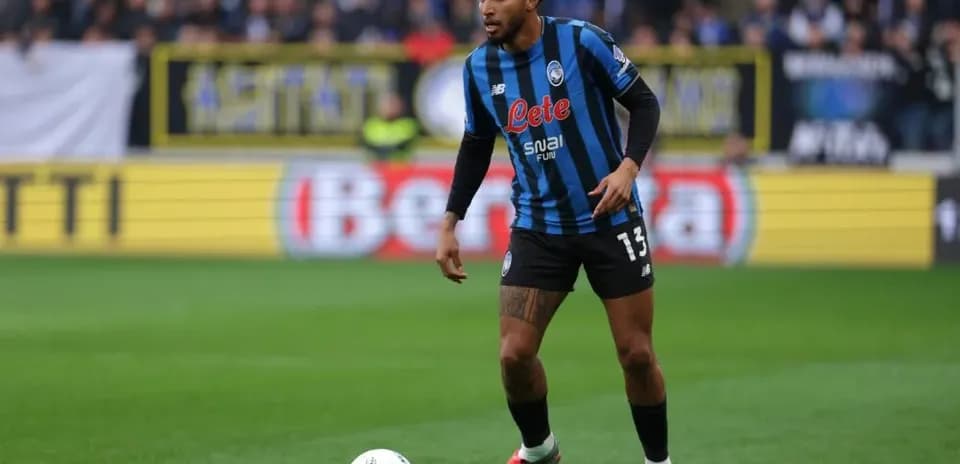 Player in Atalanta kit preparing to pass ball