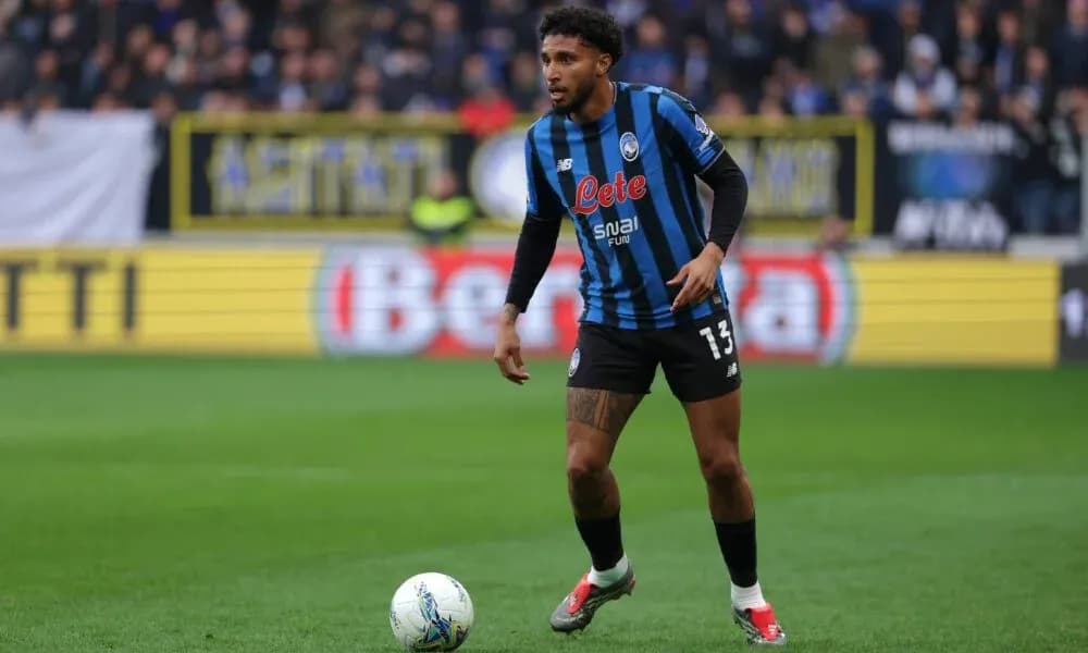 Player in Atalanta kit preparing to pass ball