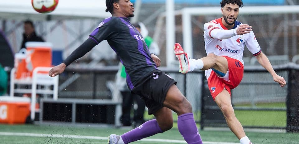 Player kicking ball during Vancouver FC match