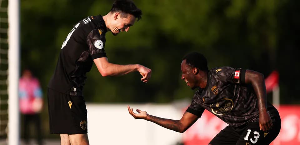 Players celebrating during Canadian Premier League match