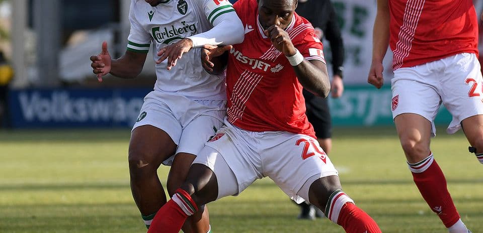 Players contesting for the ball in football match