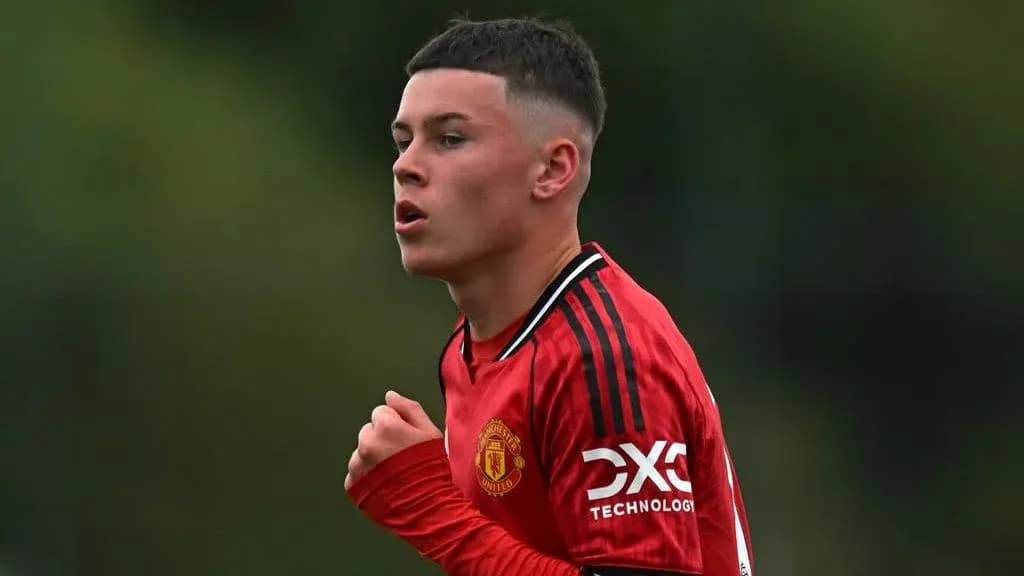 Young player in red Manchester United jersey during match