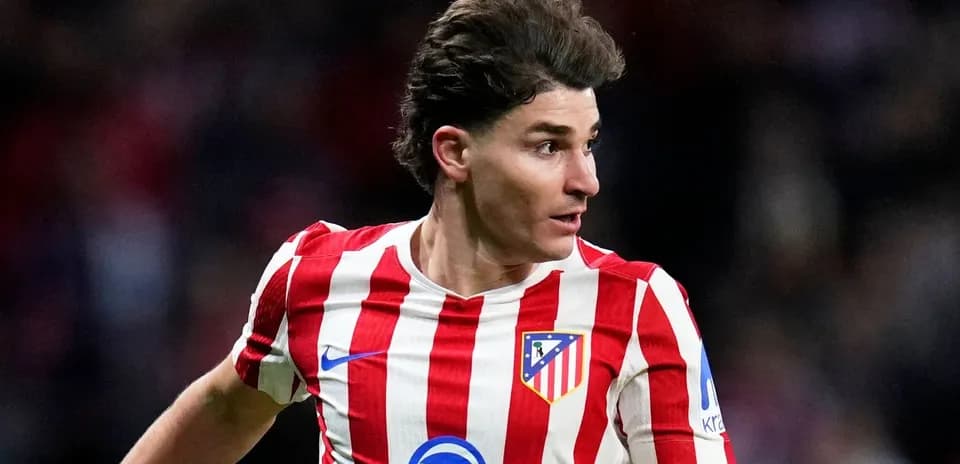 Atletico Madrid player in striped red and white jersey