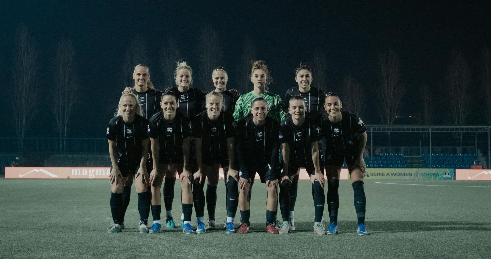 Como W team posing for a group photo