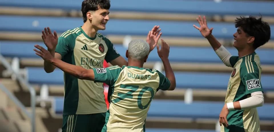 Players celebrating a goal during MLS Next Pro match