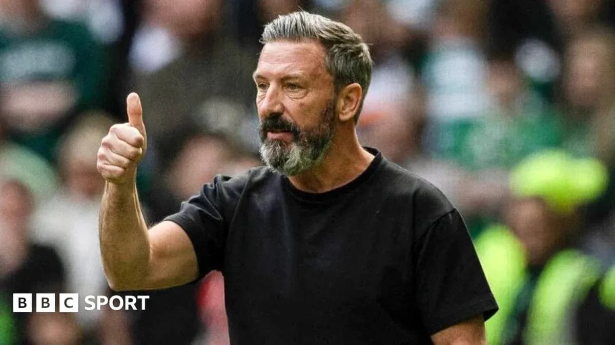 Manager giving thumbs up during match