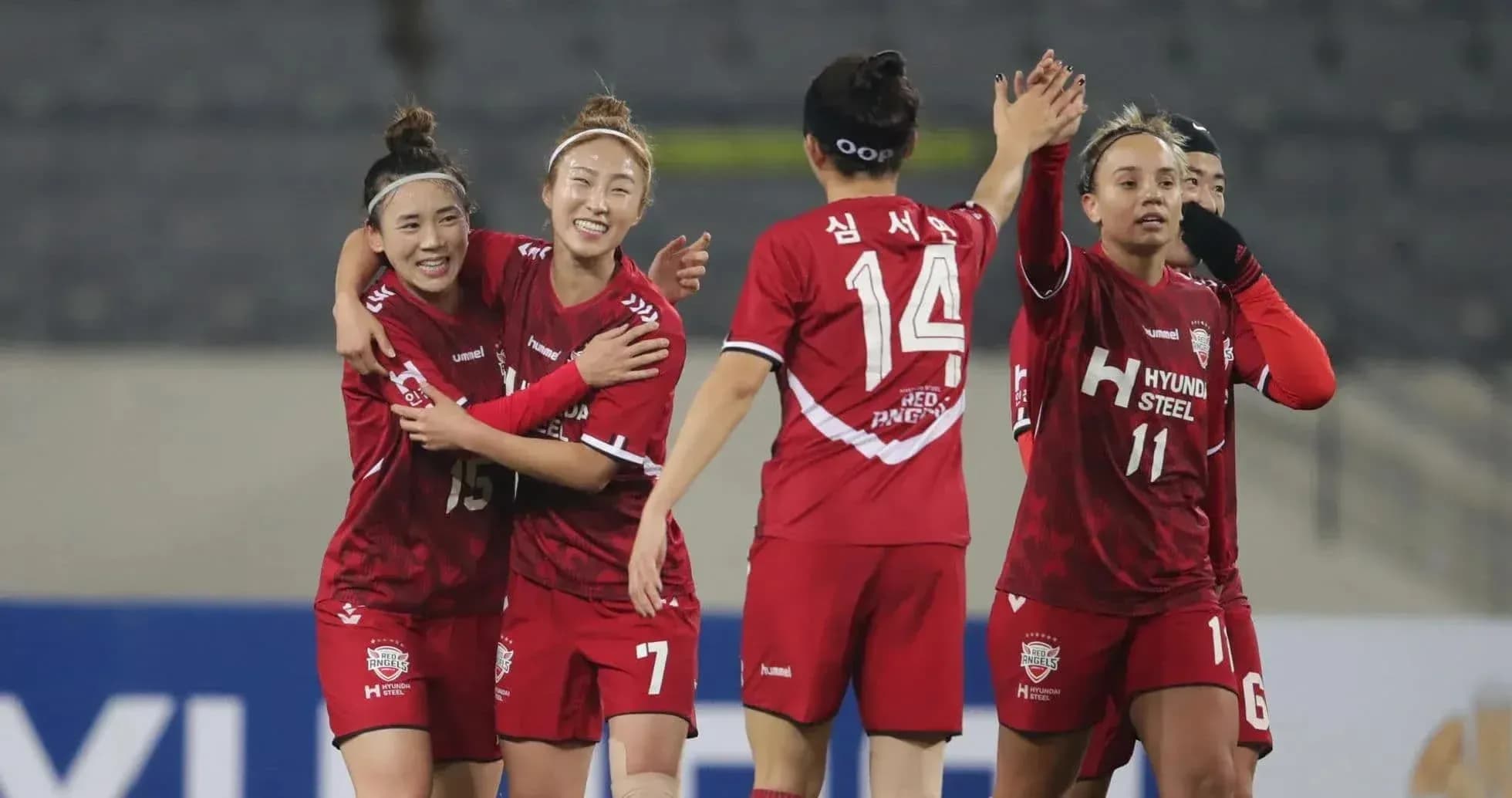 Players celebrating during WK-League match