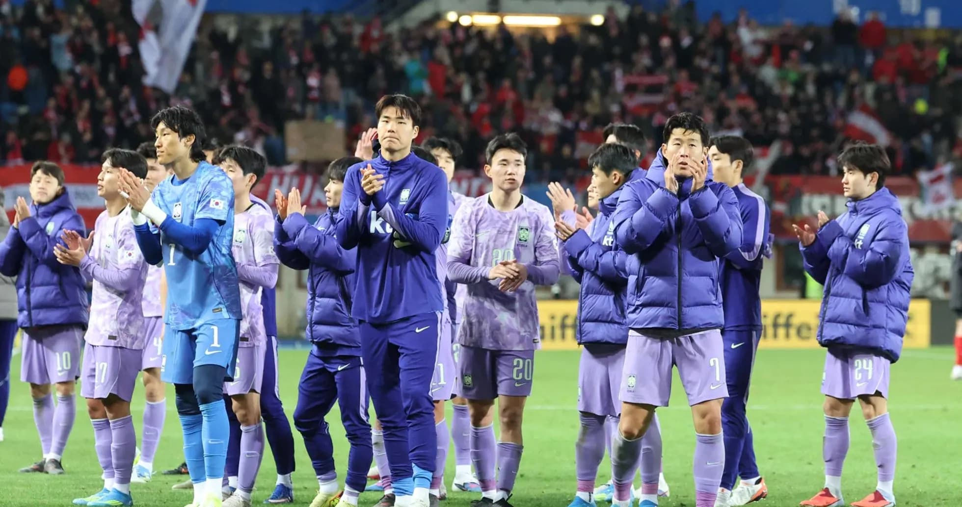 Team applauding fans after the match