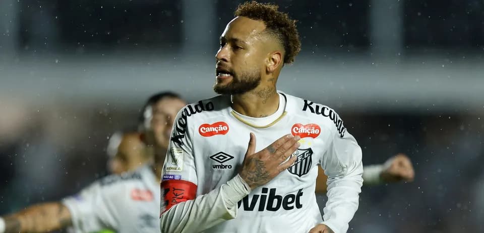 Player celebrating during match in rainy conditions