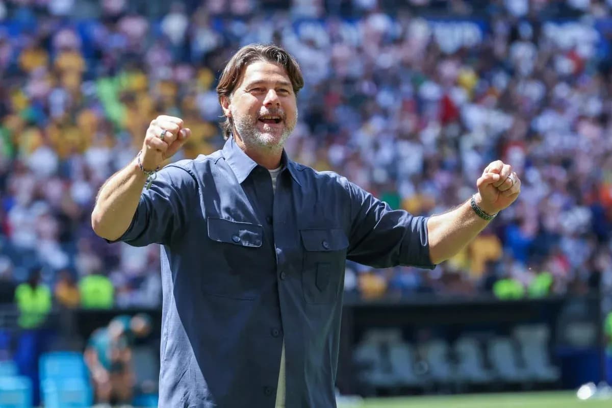 Coach celebrating during a match at stadium