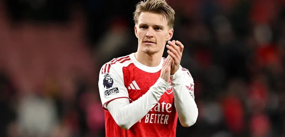 Player applauding fans after a match