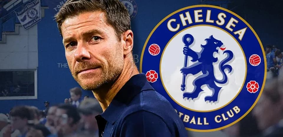 Man in front of Chelsea FC logo at stadium