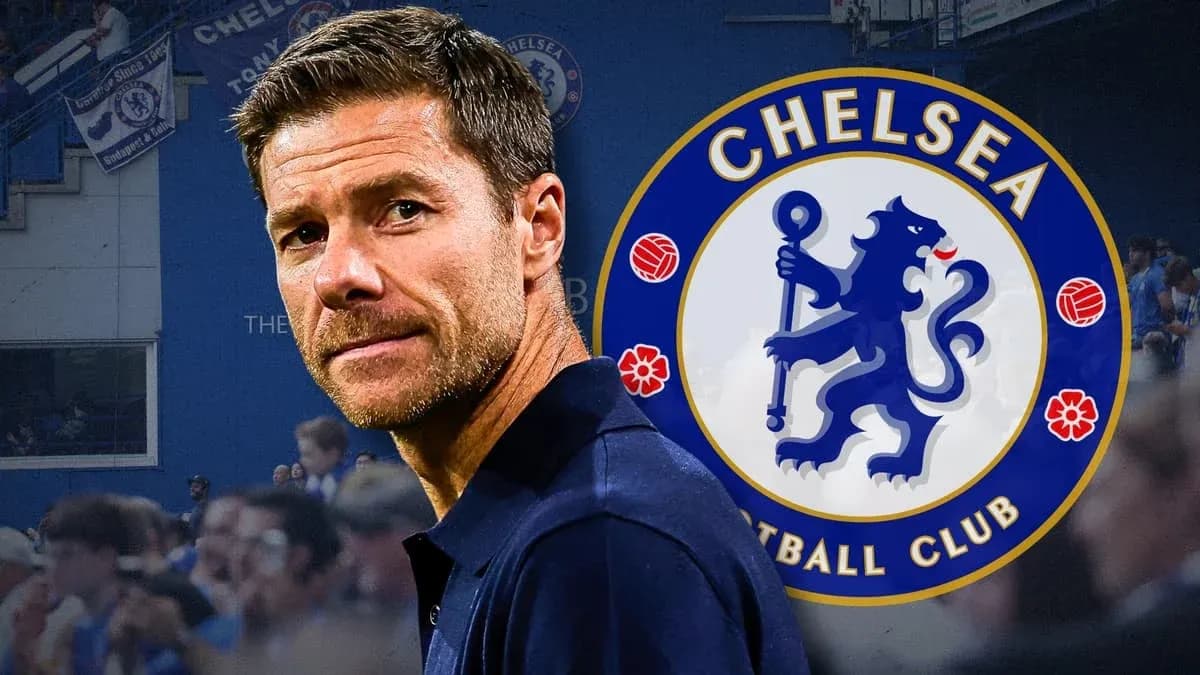 Man in front of Chelsea FC logo at stadium