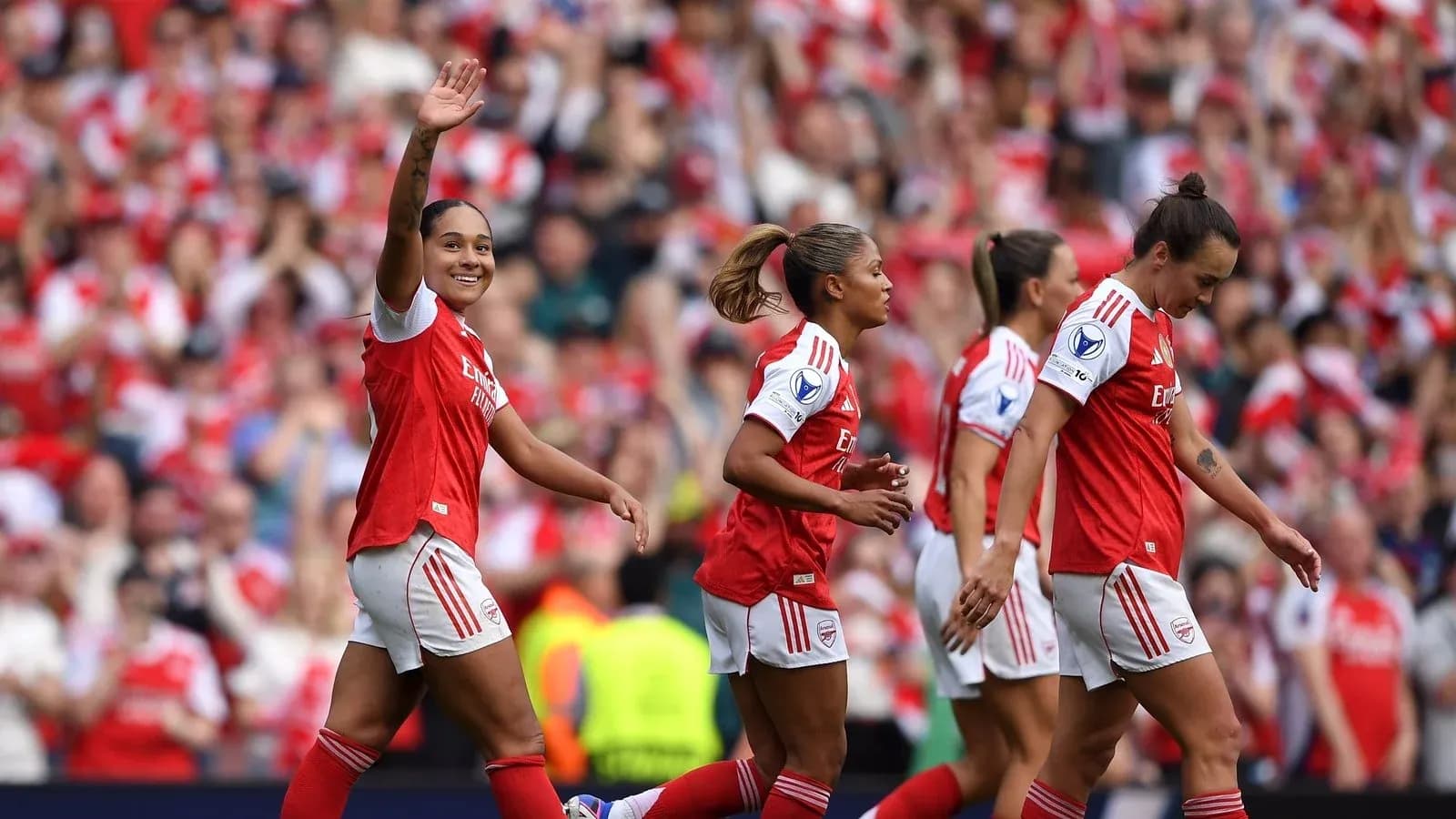 Arsenal women's players celebrating a goal together