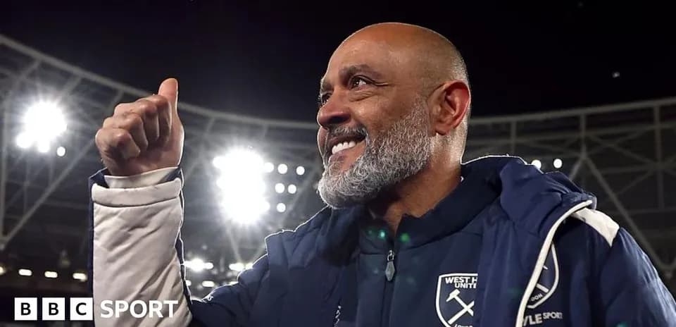 Manager celebrating with a thumbs-up gesture