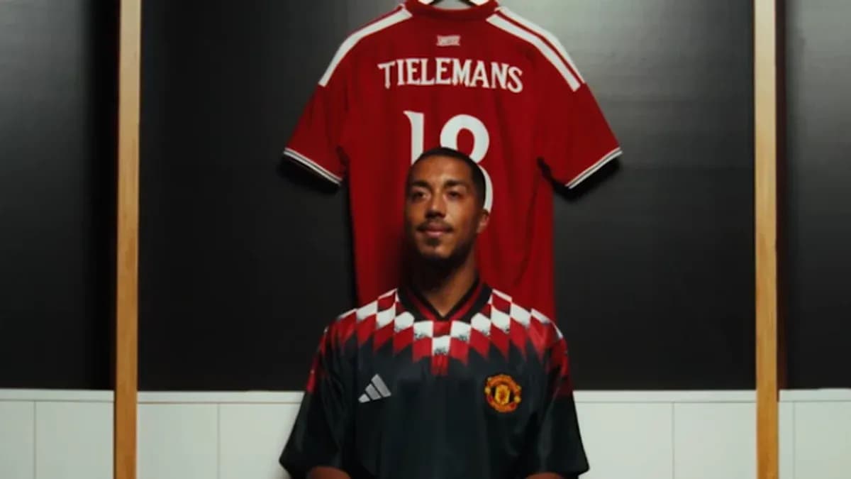 Player standing in front of jersey display