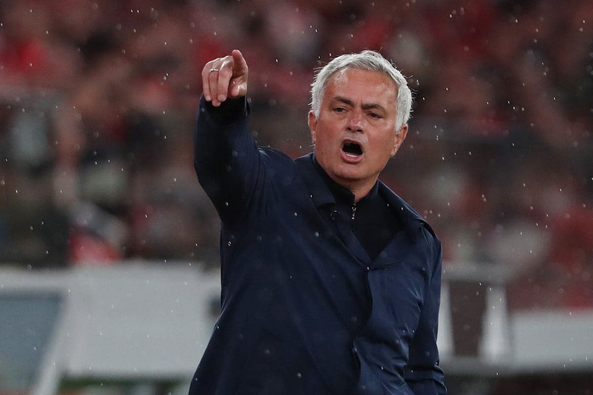 Manager giving instructions during a rainy match