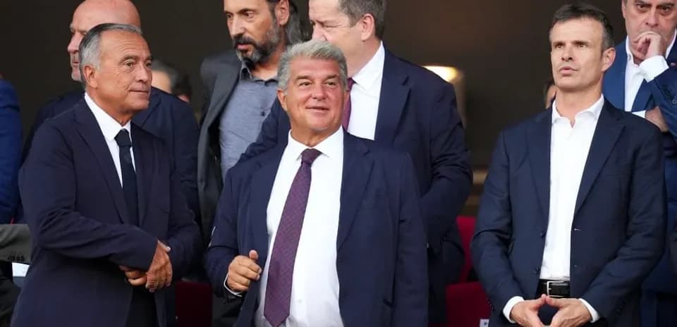 Group of executives watching a match in stadium