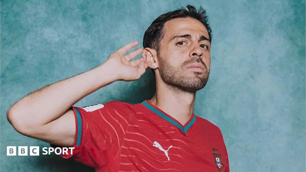 Football player posing in Portugal jersey