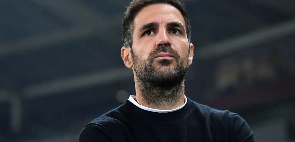 Man observing from the sidelines during a match