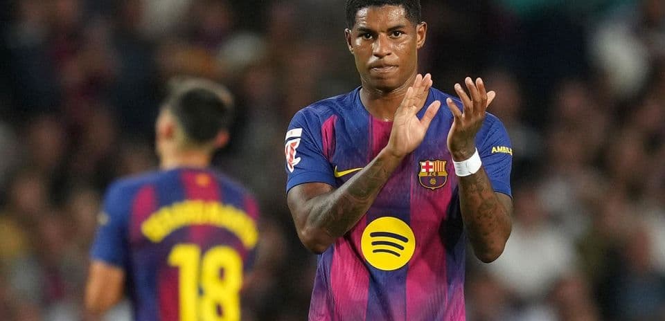 Barcelona player applauding during match on field