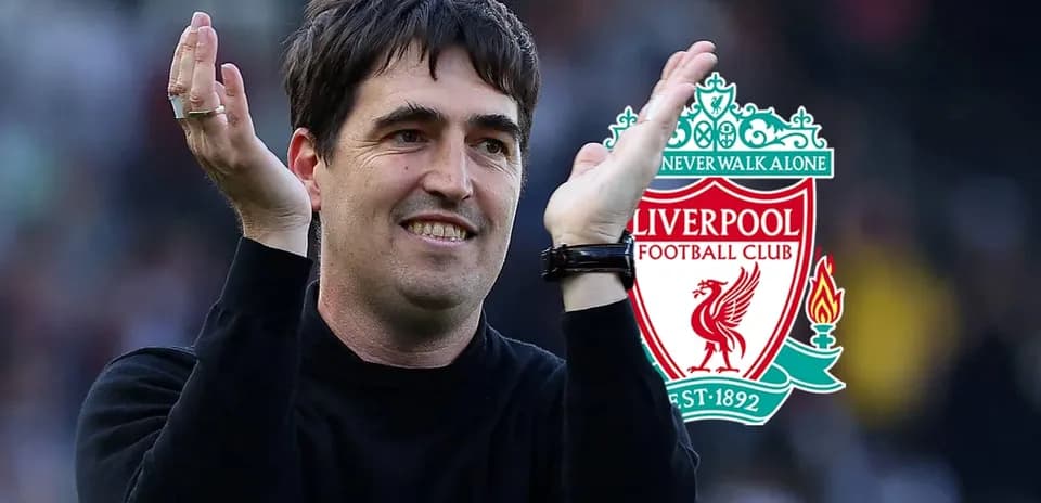 Man gesturing positively with Liverpool logo in background