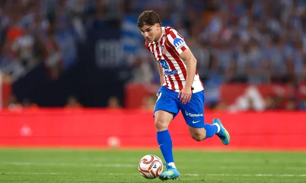 Player dribbling the ball during a match Player dribbling the ball during a match
