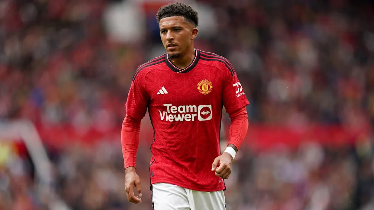 Player walking on the pitch in Manchester United kit Player walking on the pitch in Manchester United kit