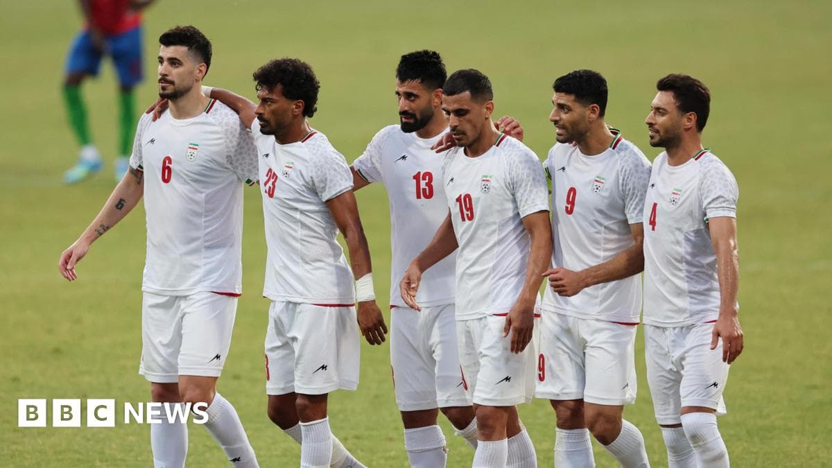 Iranian football players celebrating together on field Iranian football players celebrating together on field