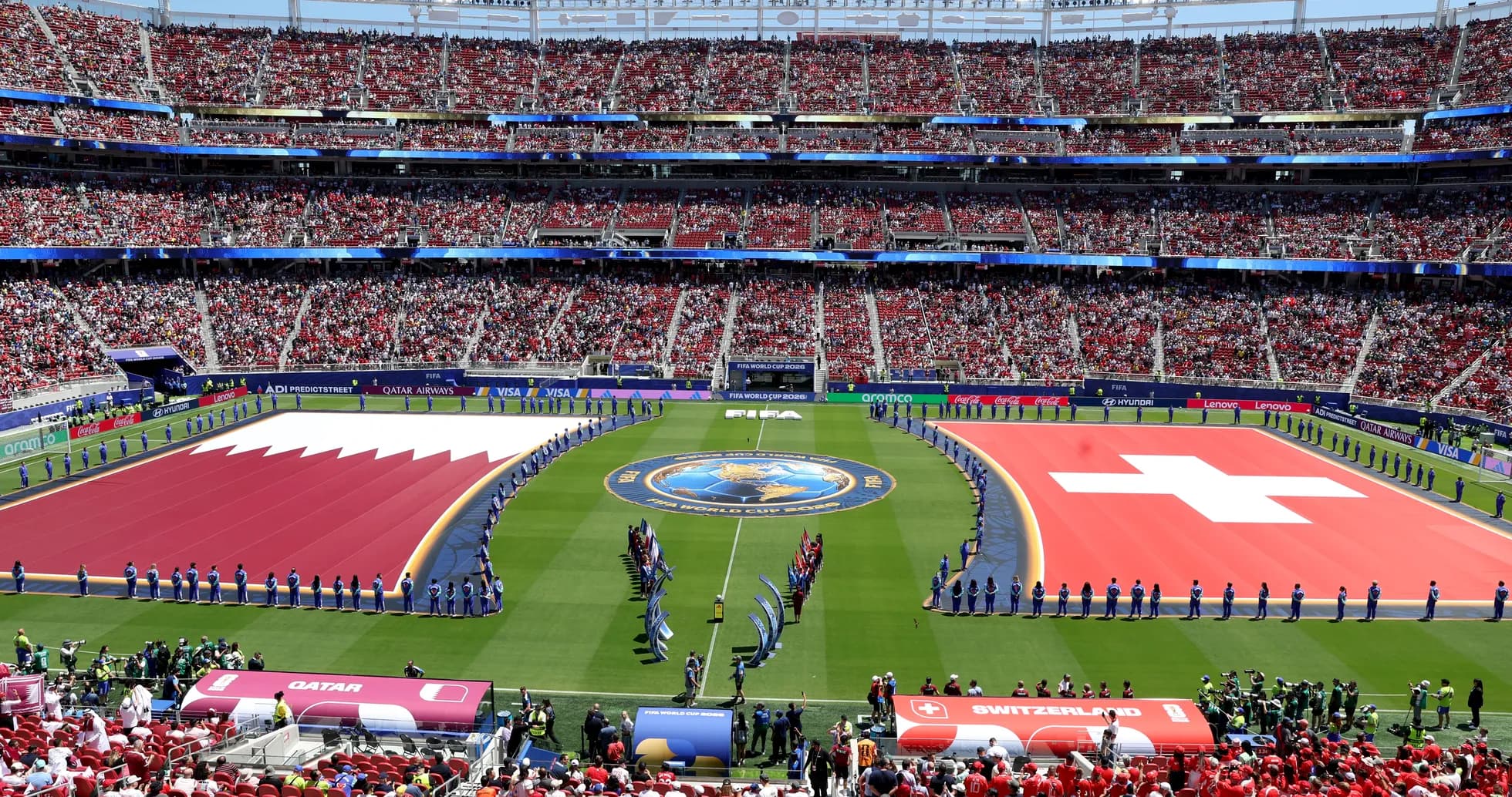 Qatar and Switzerland flags displayed at stadium Qatar and Switzerland flags displayed at stadium