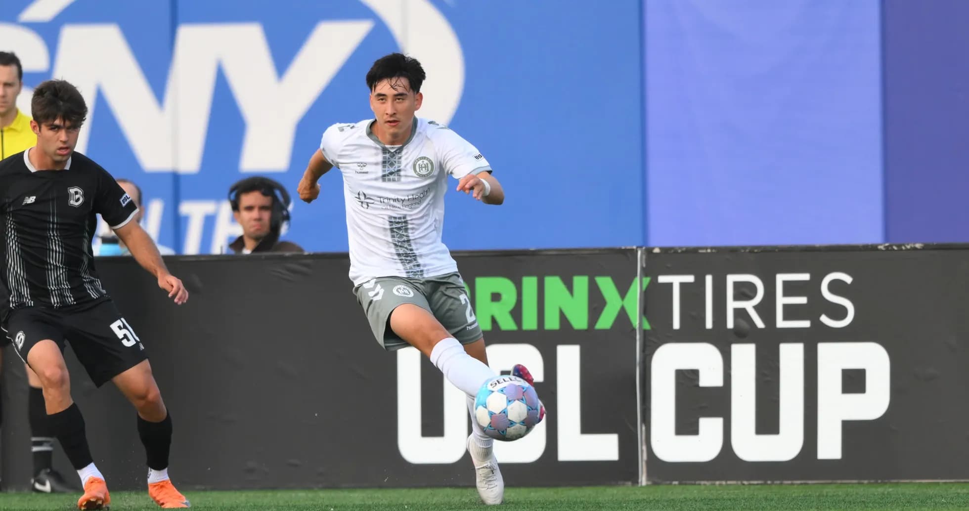 Player dribbling the ball during USL Cup match Player dribbling the ball during USL Cup match