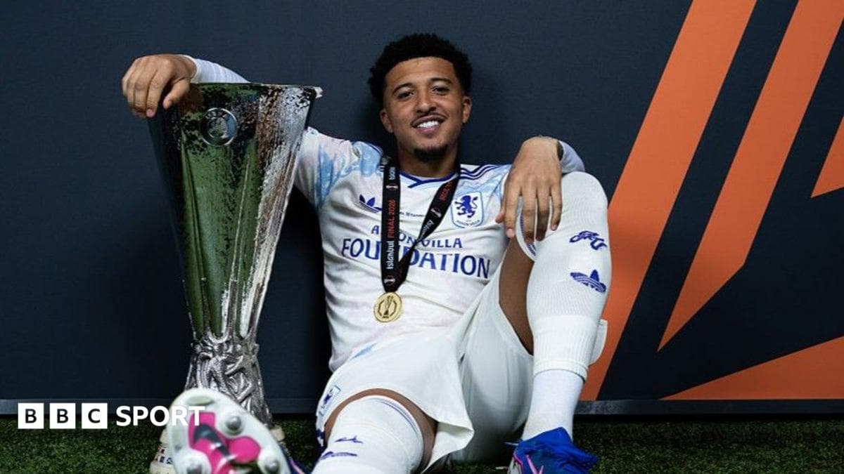 Player posing with trophy after winning final Player posing with trophy after winning final