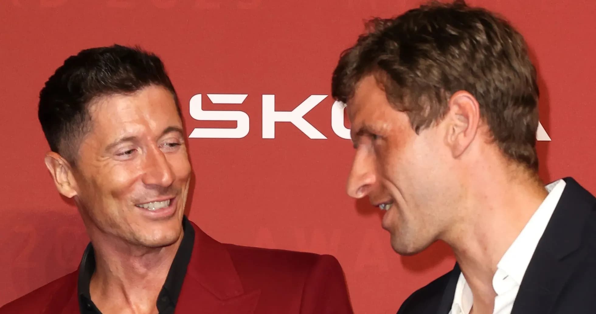 Two men interacting at an awards ceremony Two men interacting at an awards ceremony